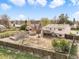 Spacious backyard featuring a deck, shed, and mature trees at 15691 E Atlantic Cir, Aurora, CO 80013