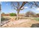 Serene backyard featuring a charming patio and lush greenery at 15691 E Atlantic Cir, Aurora, CO 80013