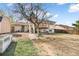 Backyard with a charming patio and a wooden deck at 15691 E Atlantic Cir, Aurora, CO 80013