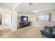 Open finished basement featuring a TV, storage and black futon at 15691 E Atlantic Cir, Aurora, CO 80013