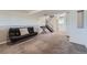 Finished basement featuring carpeted floors, neutral walls, and a keyboard at 15691 E Atlantic Cir, Aurora, CO 80013