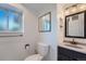 Well-lit bathroom featuring modern fixtures and a sleek, framed medicine cabinet at 15691 E Atlantic Cir, Aurora, CO 80013