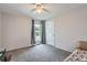 Bedroom features carpeted floors, neutral walls, and a bright window at 15691 E Atlantic Cir, Aurora, CO 80013