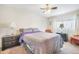 Bright bedroom featuring ample natural light, neutral paint, and bedside tables with lamps at 15691 E Atlantic Cir, Aurora, CO 80013