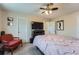 This bedroom features carpeted floors, a ceiling fan, and neutral walls at 15691 E Atlantic Cir, Aurora, CO 80013