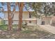 Charming home featuring a well-manicured lawn, mature trees, and a welcoming facade at 15691 E Atlantic Cir, Aurora, CO 80013