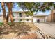 Charming two-story home featuring a well-manicured lawn, mature trees, and an attached garage for convenient parking at 15691 E Atlantic Cir, Aurora, CO 80013
