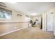 Bright living room with carpet, neutral walls, and natural light at 15691 E Atlantic Cir, Aurora, CO 80013