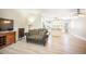 Open-concept living area seamlessly connects to the kitchen, with neutral walls and luxury vinyl plank flooring at 15691 E Atlantic Cir, Aurora, CO 80013