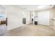 Open living room with carpet, neutral walls, and views to other rooms at 15691 E Atlantic Cir, Aurora, CO 80013