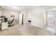 Open living room with neutral walls, desk area, and lots of natural light at 15691 E Atlantic Cir, Aurora, CO 80013