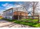 A shot of a deck on the back of the home with a wooden fence and grass at 4087 S Clarkson S St, Englewood, CO 80113