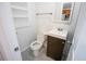 Bathroom featuring a new vanity, toilet, and shelving unit at 4087 S Clarkson S St, Englewood, CO 80113