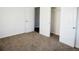 Bedroom showcasing neutral carpet, closet, and a door leading to other rooms at 4087 S Clarkson S St, Englewood, CO 80113