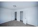 Bright bedroom with neutral carpet and an open closet, offering ample storage space at 4087 S Clarkson S St, Englewood, CO 80113