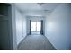 A light and airy bedroom with sliding glass door and neutral carpeting at 4087 S Clarkson S St, Englewood, CO 80113