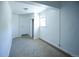 Cozy bedroom featuring neutral carpet, white walls, closet, and a window with natural light at 4087 S Clarkson S St, Englewood, CO 80113