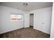 Cozy bedroom with neutral carpet, white walls, window, and closet at 4087 S Clarkson S St, Englewood, CO 80113