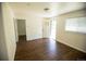 Bright living room boasting wood floors, white walls, and a door leading outside at 4087 S Clarkson S St, Englewood, CO 80113