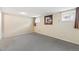 Large basement bedroom with two windows and carpeted floors at 7492 W Cedar Cir, Lakewood, CO 80226