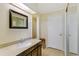 Bright bathroom with granite counters and tiled floors at 7492 W Cedar Cir, Lakewood, CO 80226