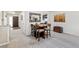 Dining room featuring a modern table with bar stool seating at 7492 W Cedar Cir, Lakewood, CO 80226