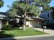 Charming two-story home with a well-manicured lawn and mature landscaping in a suburban neighborhood at 7492 W Cedar Cir, Lakewood, CO 80226