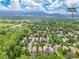 Aerial view of 76 Mineola Ct near the University of Colorado with mountain views and tree-lined streets at 76 Mineola Ct, Boulder, CO 80303