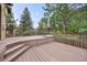 A large wooden deck provides a cozy outdoor living space, perfect for relaxation and entertainment at 76 Mineola Ct, Boulder, CO 80303