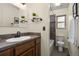 Bathroom features ceramic sink, updated vanity, and updated shower and toilet at 76 Mineola Ct, Boulder, CO 80303