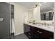 A stylish bathroom features a double sink vanity with granite countertops and a glass-enclosed shower at 76 Mineola Ct, Boulder, CO 80303