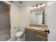 Bathroom featuring a vanity with granite countertop, a toilet, and a shower with glass doors at 76 Mineola Ct, Boulder, CO 80303