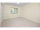 A neutral colored bedroom includes a large closet, a window, neutral carpet, baseboards, and light walls at 76 Mineola Ct, Boulder, CO 80303