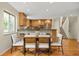 Bright dining room features hardwood floors, seating for six, open to the kitchen and staircase to the second floor at 76 Mineola Ct, Boulder, CO 80303