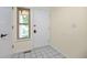 Bright entryway featuring tile floors, a coat closet, and natural light from the window at 76 Mineola Ct, Boulder, CO 80303