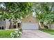 Charming home featuring a two-car garage, lush front yard, and mature trees at 76 Mineola Ct, Boulder, CO 80303