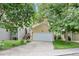 Inviting exterior view of the home with a well-kept lawn and attached two-car garage at 76 Mineola Ct, Boulder, CO 80303