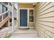 Charming front entrance featuring a gray door with a window and a cozy covered porch at 76 Mineola Ct, Boulder, CO 80303