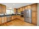 Updated kitchen boasts stainless appliances, lots of storage, sleek countertops, and hardwood floors at 76 Mineola Ct, Boulder, CO 80303