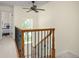 View of staircase featuring wood railing, black iron balusters, and large window at 76 Mineola Ct, Boulder, CO 80303