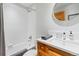 Bright bathroom featuring white tiling in shower and wood vanity at 293 Settlers Dr, Breckenridge, CO 80424