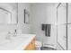 Bright bathroom featuring glass shower, wood vanity, and stylish decor at 293 Settlers Dr, Breckenridge, CO 80424