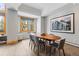 The dining area features a large window, modern table and seating, and an art piece at 293 Settlers Dr, Breckenridge, CO 80424