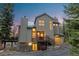 Charming home boasts a craftsman style design and inviting curb appeal with mature trees and mountain views at 293 Settlers Dr, Breckenridge, CO 80424