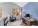 Upstairs home office with a modern desk, chair, and natural light, perfect for a productive and comfortable work environment at 293 Settlers Dr, Breckenridge, CO 80424