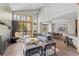 Bright, open-concept living room features a modern fireplace, high ceilings, and floor to ceiling windows at 293 Settlers Dr, Breckenridge, CO 80424