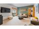 Cozy living room featuring comfortable seating, modern TV, and access to the outdoors at 293 Settlers Dr, Breckenridge, CO 80424