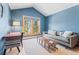 Comfortable living room with vaulted ceiling, cozy sofa, large window with neighborhood views at 293 Settlers Dr, Breckenridge, CO 80424