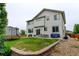 Exterior of the two story home, showing the back patio, level yard, and trampoline at 1995 E 166Th Ave, Thornton, CO 80602