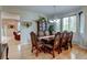 Elegant dining room featuring hardwood floors, a decorative hutch, and a stylish chandelier at 1995 E 166Th Ave, Thornton, CO 80602